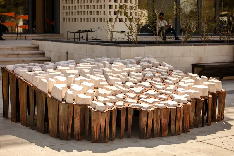 ARID, an installation of pale blocks set in a rust-colored steel frame, Amman